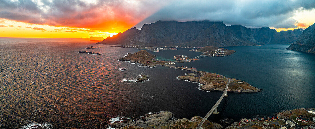 Aerial panoramic view of Reine Bay and fjord under a fiery sky at sunset, Lofoten Islands, Nordland, Norway, Scandinavia, Europe\n