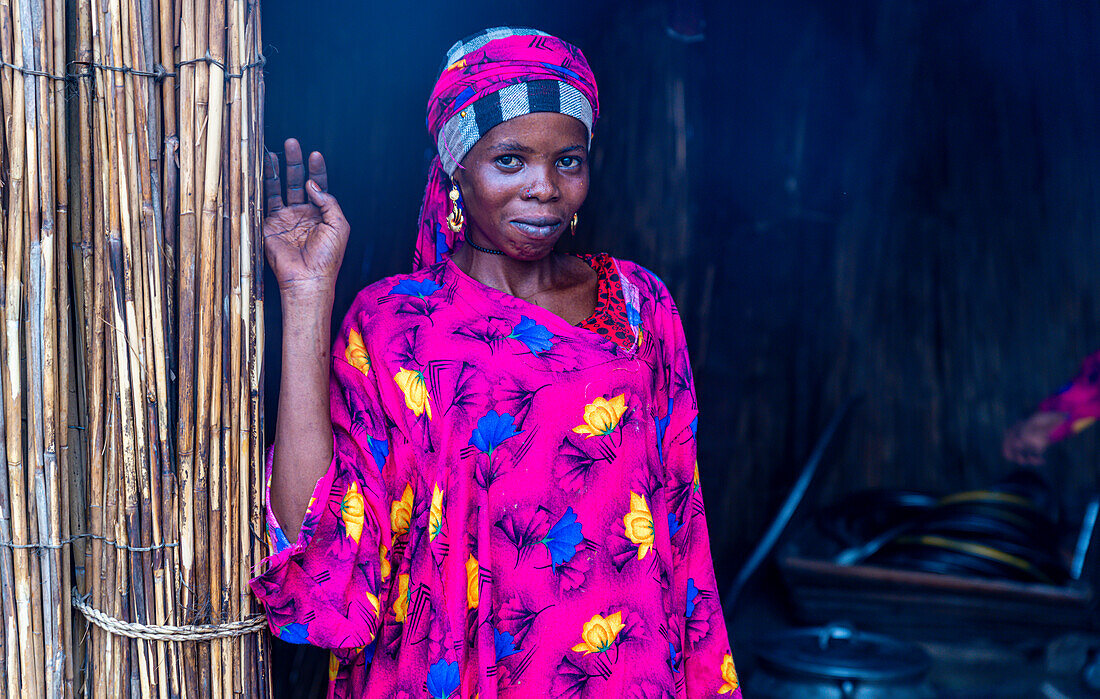 Portrait of a local woman in bright pink clothes, Lake Chad, Chad, Africa\n