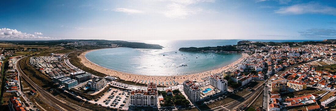 Aerial drone panoramic view of Sao Martinho do Porto bay, shaped like a scallop with calm waters and fine white sand, Oeste, Portugal, Europe\n