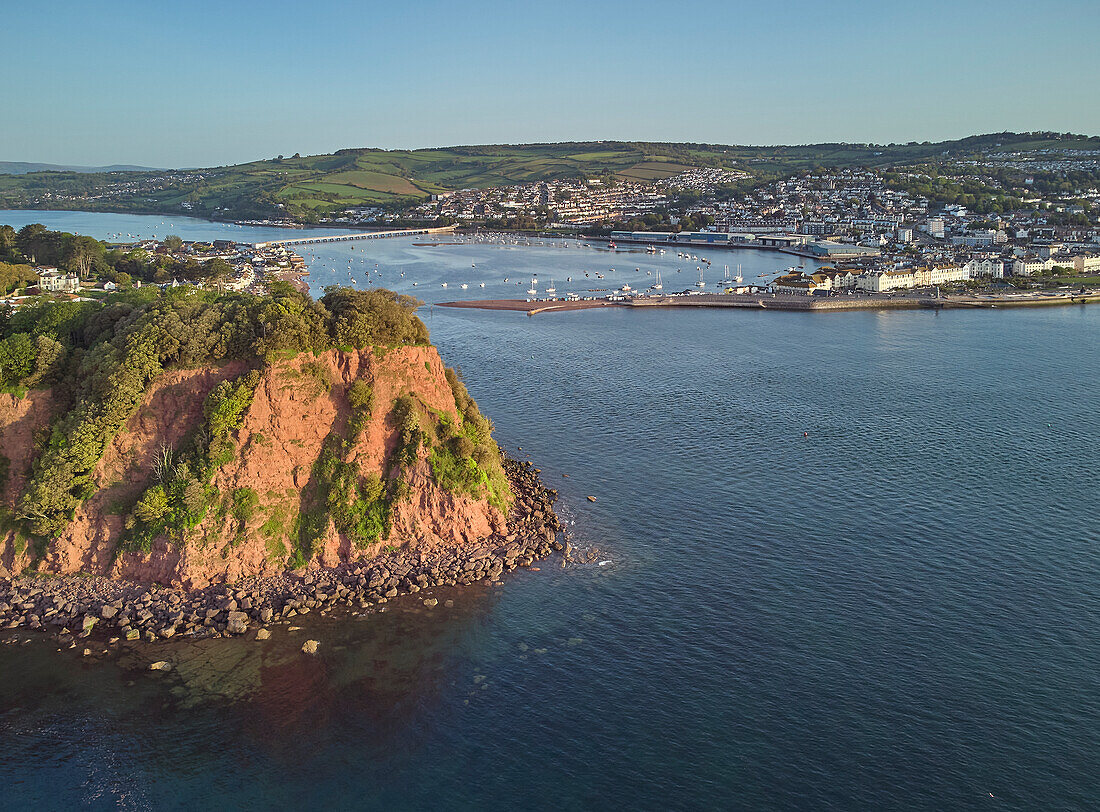 A view across the Ness headland to the mouth of the River Teign and the harbour and tourist resort of Teignmouth, on the south Devon coast, England, United Kingdom, Europe\n