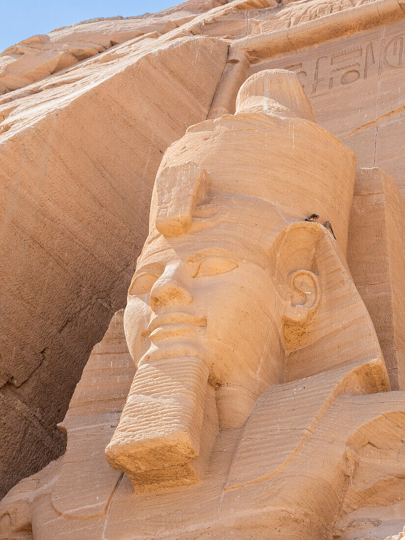 Detail of The Great Temple of Abu Simbel with its iconic 20 meter tall seated colossal statues of Ramses II (Ramses The Great), UNESCO World Heritage Site, Abu Simbel, Egypt, North Africa, Africa\n