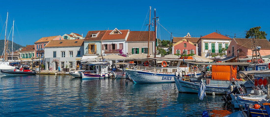 View of cafes and shops in Fiscardo harbour, Fiscardo, Kefalonia, Ionian Islands, Greek Islands, Greece, Europe\n