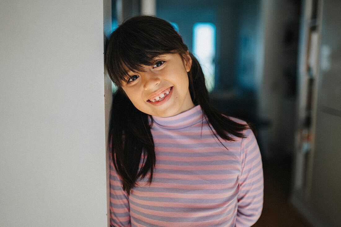 Portrait of happy smiling girl at home\n