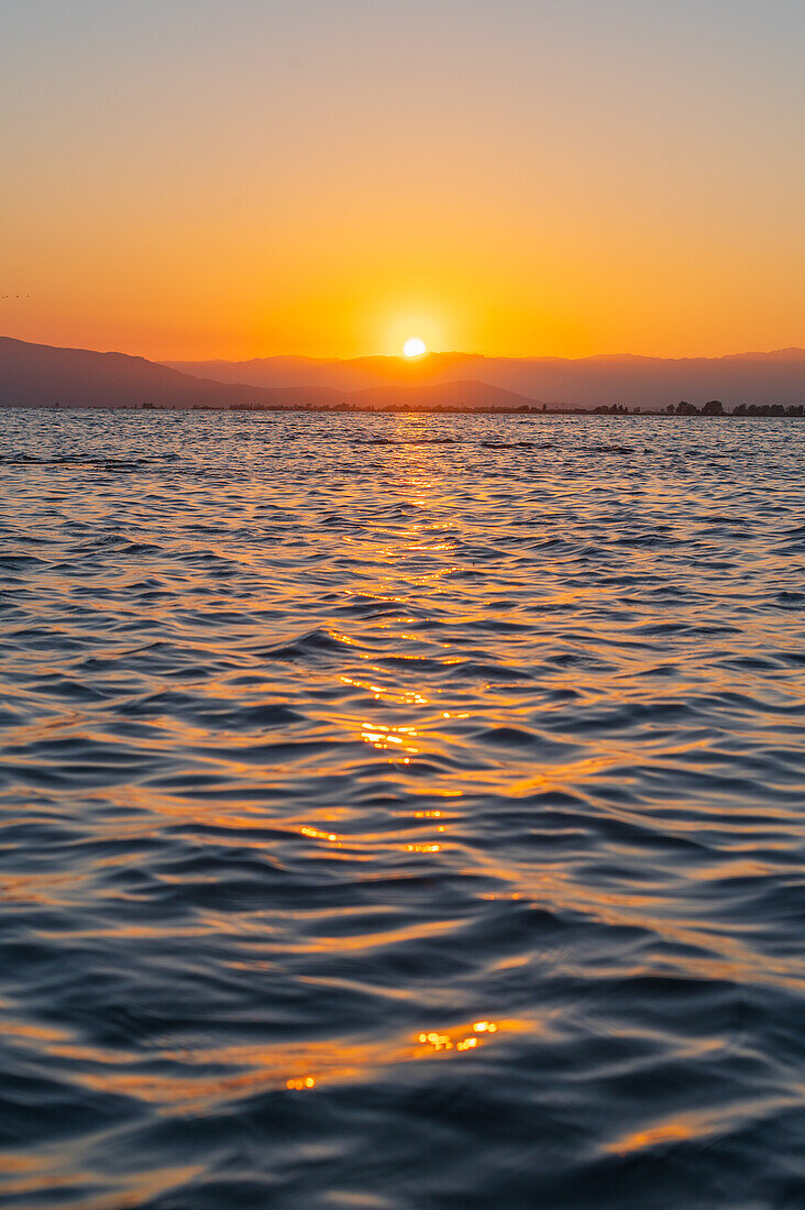 Sunset at Trabucador beach, Ebro Delta, Tarragona, Spain\n