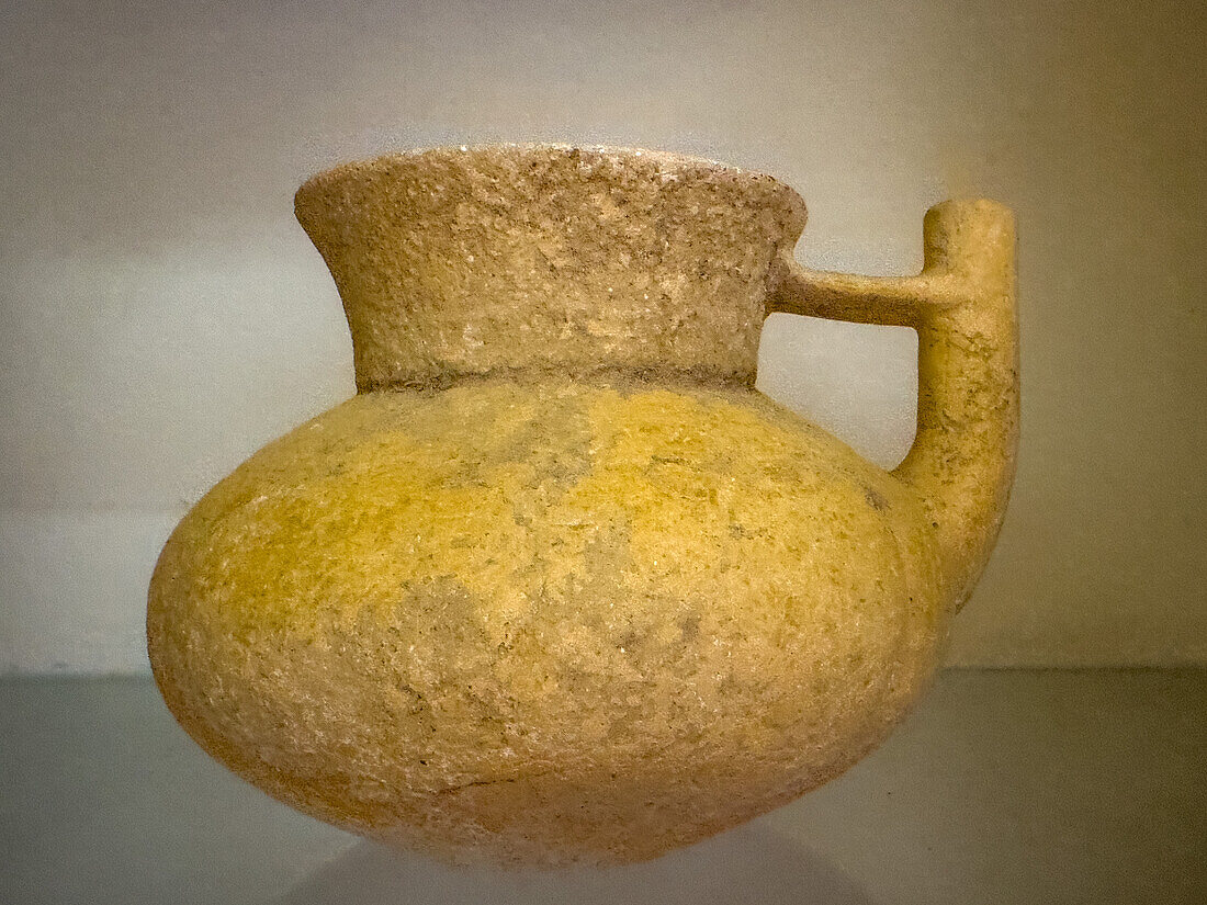 A Mayan ceramic pot in the visitors center museum in the Cahal Pech Archeological Reserve in San Ignacio, Belize.\n