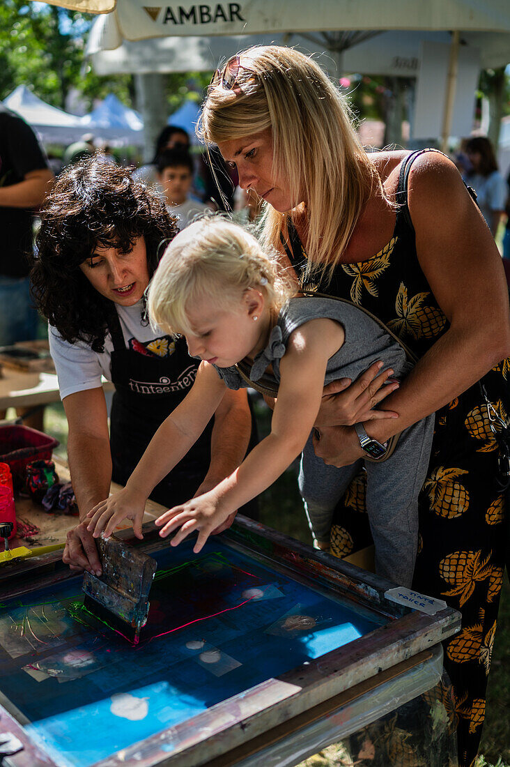 DIY posters with Natalia Royo from Tintaentera at Asalto International Urban Art Festival in Zaragoza, Spain\n