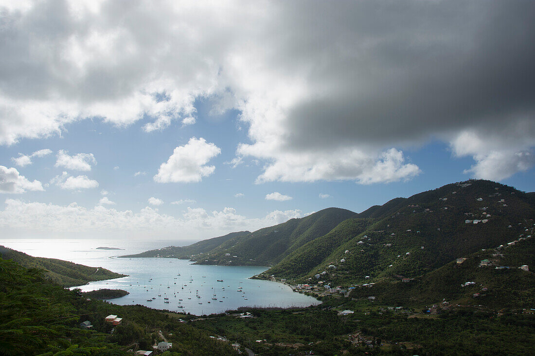 Thick clouds over Coral Bay with sailboats\n