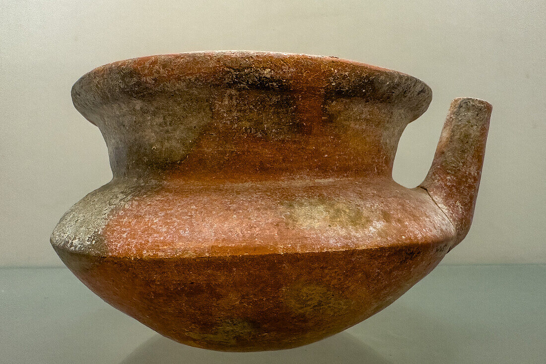 A Mayan ceramic pot in the visitors center museum in the Cahal Pech Archeological Reserve in San Ignacio, Belize.\n