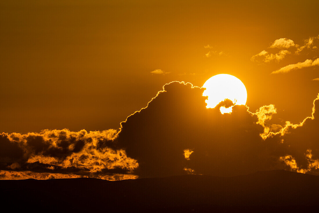 Sky with clouds and setting sun\n