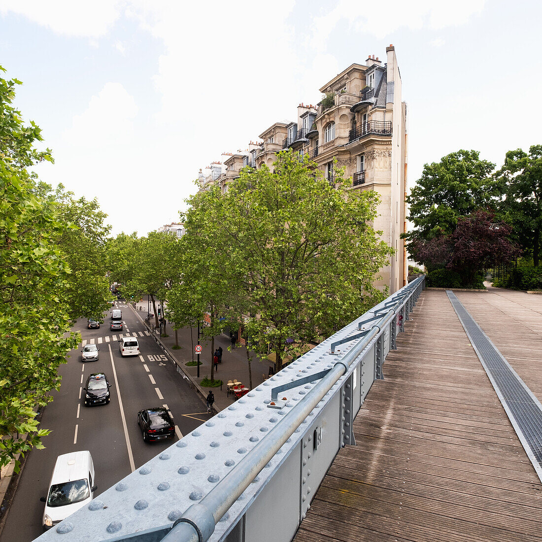 France, Paris, Pedestrian bridge above city street and traffic \n