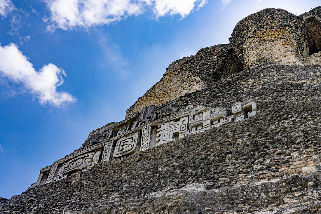 The west frieze on El Castillo or Structure A-6 in the Mayan ruins of the Xunantunich Archeological Reserve in Belize. The center figure is identified as Kawil, an ancestral deity.\n