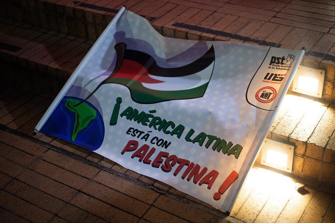 Supporters of Palestine rally outside the Israelian embassy in Bogota, Colombia by waving Palestine flags and banners, on October 10, 2023.\n