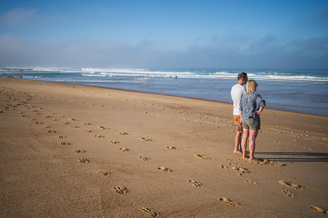 Couple on Les Culs Nus beach, Hossegor, France\n