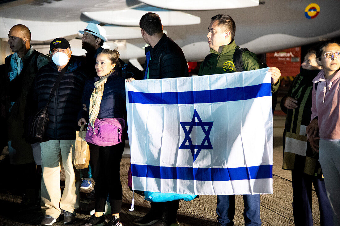 Colombians arrive in a Colombian Aerospacial force (Air Force) humanitarian flight from Tel Aviv, Israel after the Palestinian militant group Hamas made a surprise attack, in Bogota, Colombia, October 13, 2023.\n