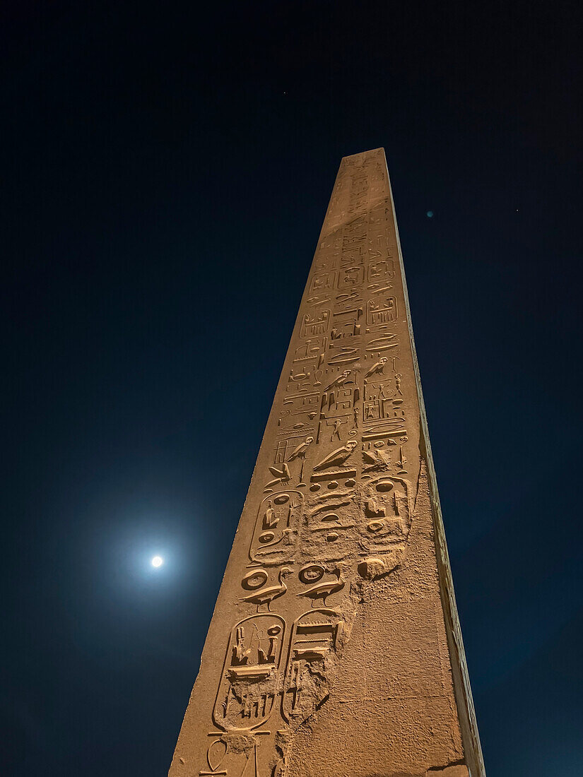 Obelisk at the Luxor Temple, at night under a full moon, constructed approximately 1400 BCE, UNESCO World Heritage Site, Luxor, Thebes, Egypt, North Africa, Africa\n