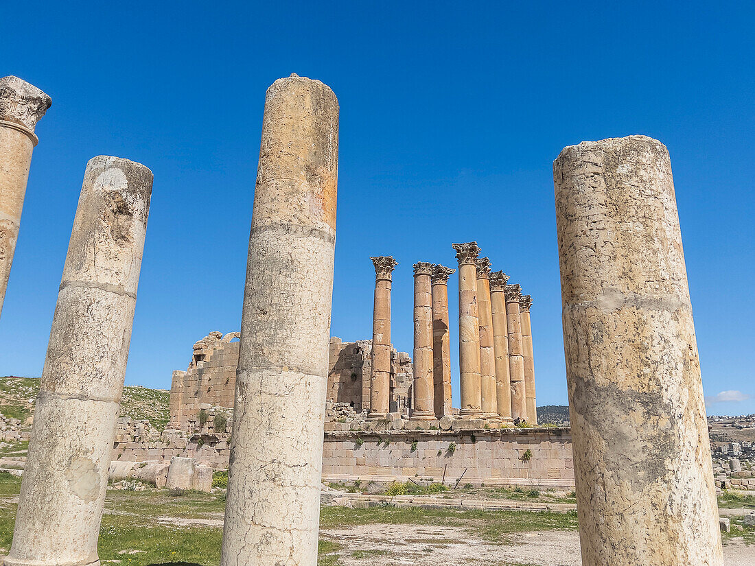 Columns frame a building in the ancient city of Jerash, believed to be founded in 331 BC by Alexander the Great, Jerash, Jordan, Middle East\n