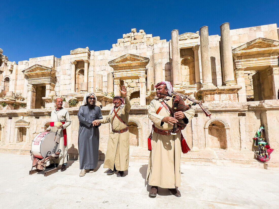 Performers at the great North Theater in the ancient city of Jerash, believed to be founded by Alexander the Great, Jerash, Jordan, Middle East\n