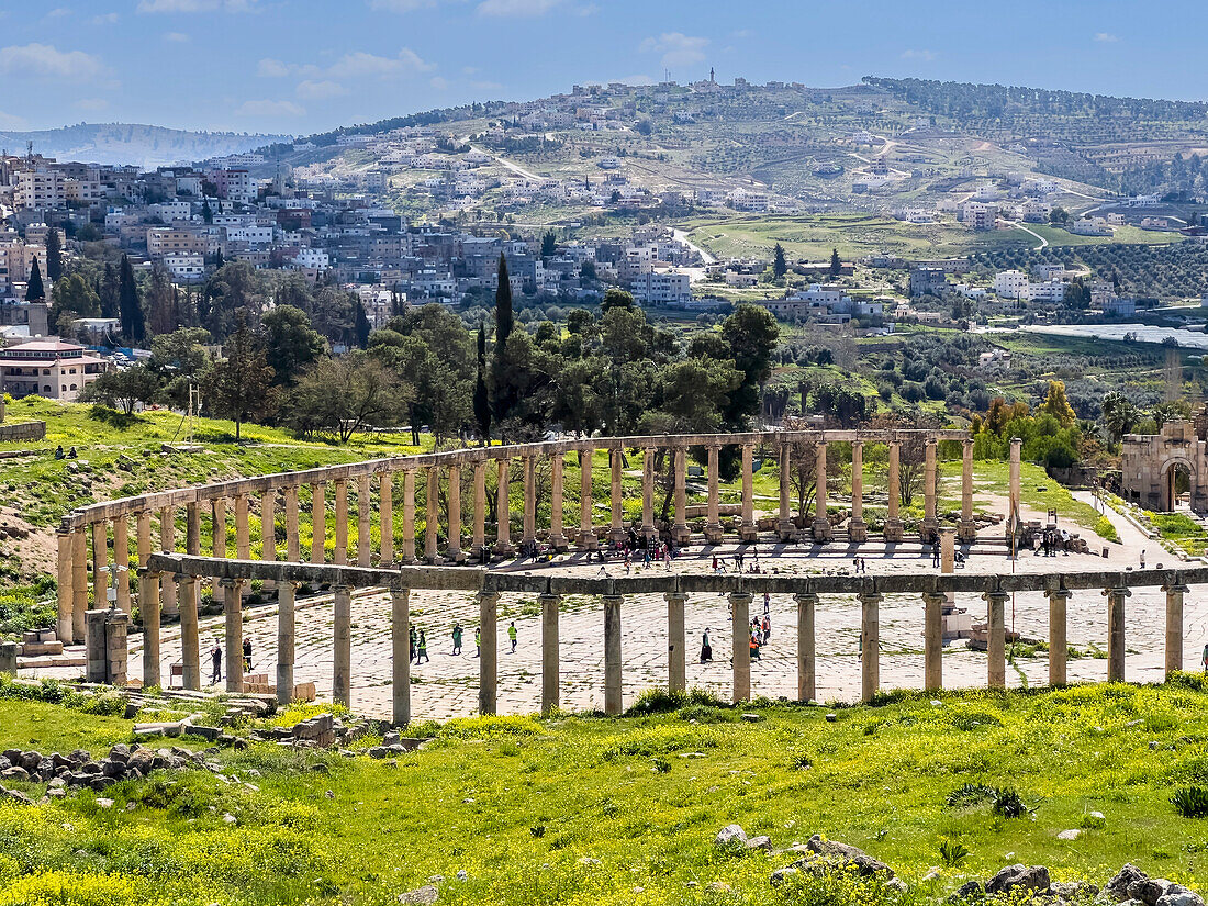 Columns frame the Oval Plaza in the ancient city of Jerash, believed to be founded in 331 BC by Alexander the Great, Jerash, Jordan, Middle East\n