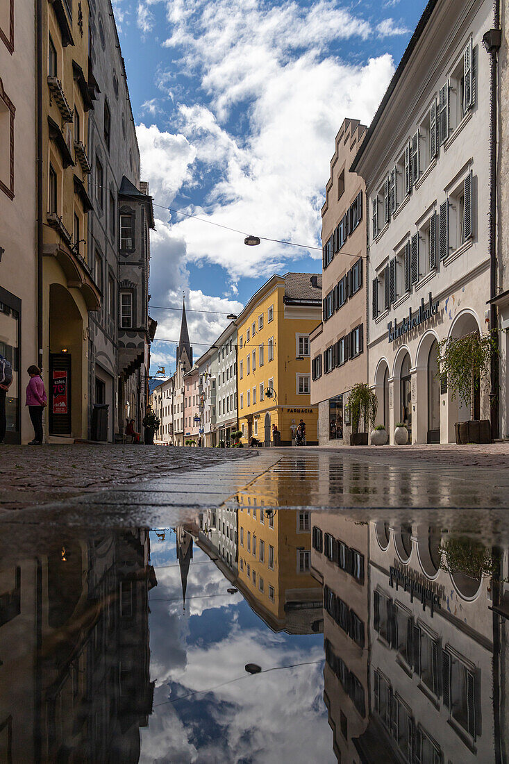 Central street, after rain in the old town, Bruneck, Sudtirol (South Tyrol) (Province of Bolzano), Italy, Europe\n