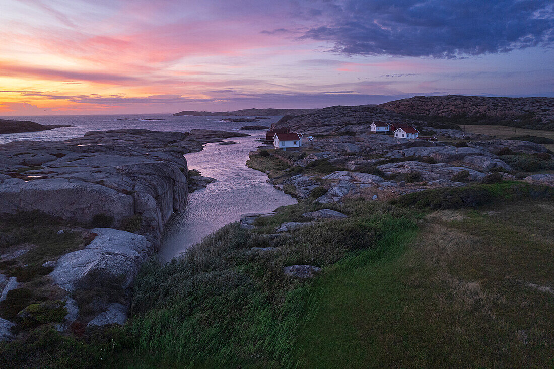 Dusk time on Ramsvik island with isolated houses on granite rocks facing the ocean, Bohuslan, Vastra Gotaland, West Sweden, Sweden, Scandinavia, Europe\n