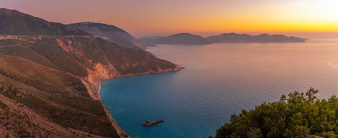 View of coastline, sea and hills near Assos at sunset, Kefalonia, Ionian Islands, Greek Islands, Greece, Europe\n