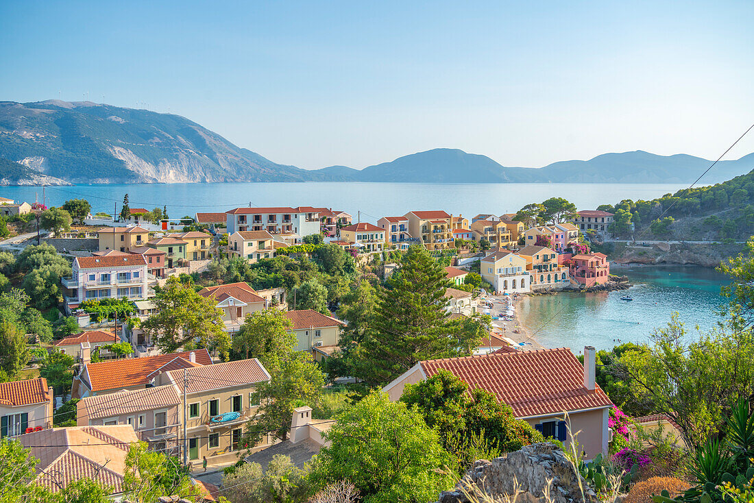 Elevated view of harbour and colourful houses in Assos, Assos, Kefalonia, Ionian Islands, Greek Islands, Greece, Europe\n