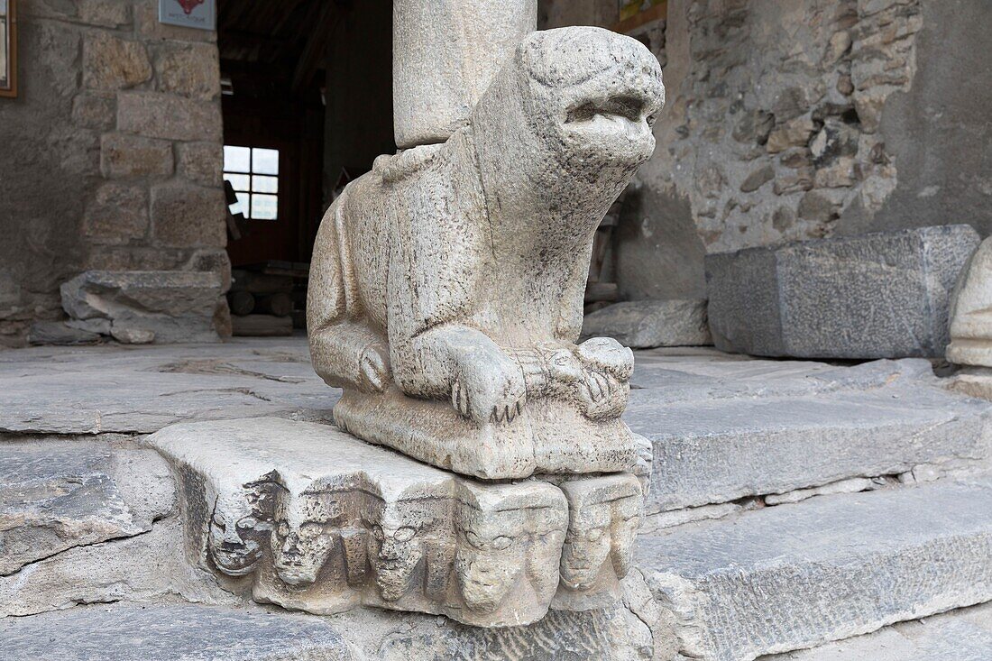 France, Hautes Alpes, Saint Veran, Queyras regional natural park, carved lion holding a child, under the of the church porch\n