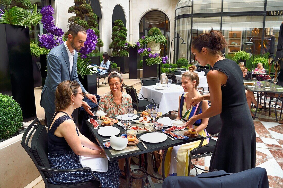 France, Paris, Four Seasons Hotel George V, L'Orangerie restaurant in the courtyard\n