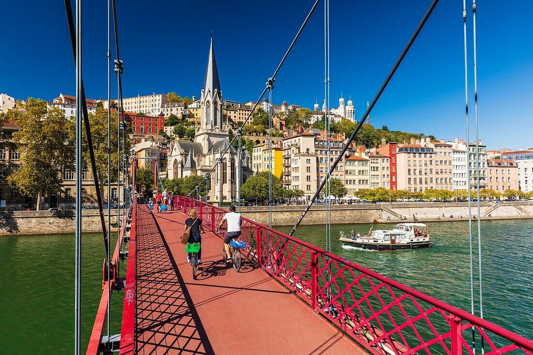 France, Rhone, Lyon, historic centre classified as a UNESCO World Heritage site, Paul Couturier footbridge over the Saone river, Saint-Georges church and Notre-Dame de Fourviere in the background\n