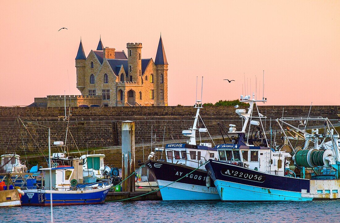 France, Morbihan, wild coast, Quiberon peninsula, fishing boats from Port Maria in line with the Turpault castle\n