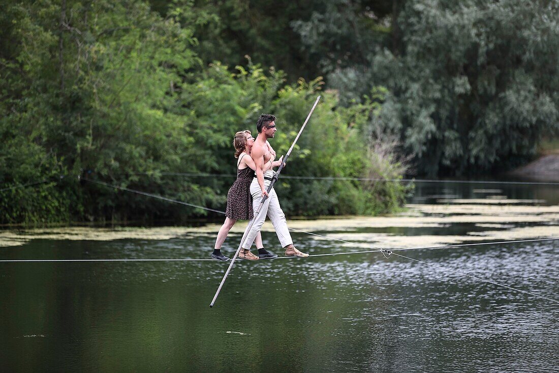 France, Indre et Loire, Cher valley, Jour de Cher, dam of Nitray, Athee sur Cher, tightrope walker, popular event imagined by the Blere - Val de Cher community of communes to highlight the Cher valley and its river heritage\n