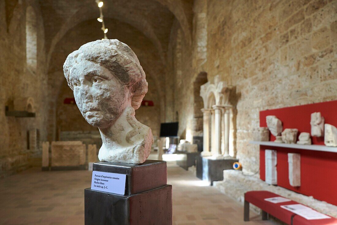 France, Herault, Saint Guilhem le Desert, the medieval village with the Gellone abbey listed as World Heritage Site by UNESCO under the Way of Saint Jacques de Compostelle in France, Abbey museum located in the former refectory of the Benedictine monks, marble portrait of a Roman empress\n