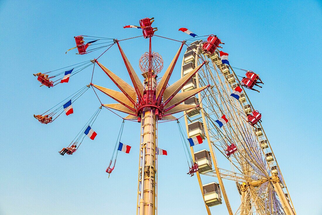 France, Paris, Tuileries garden, Fun Fair, Carousel and Ferris Wheel\n