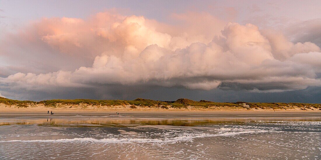 France, Somme, Quend-Plage, a stormy sky settles gradually over the beach at dusk, with special lights\n