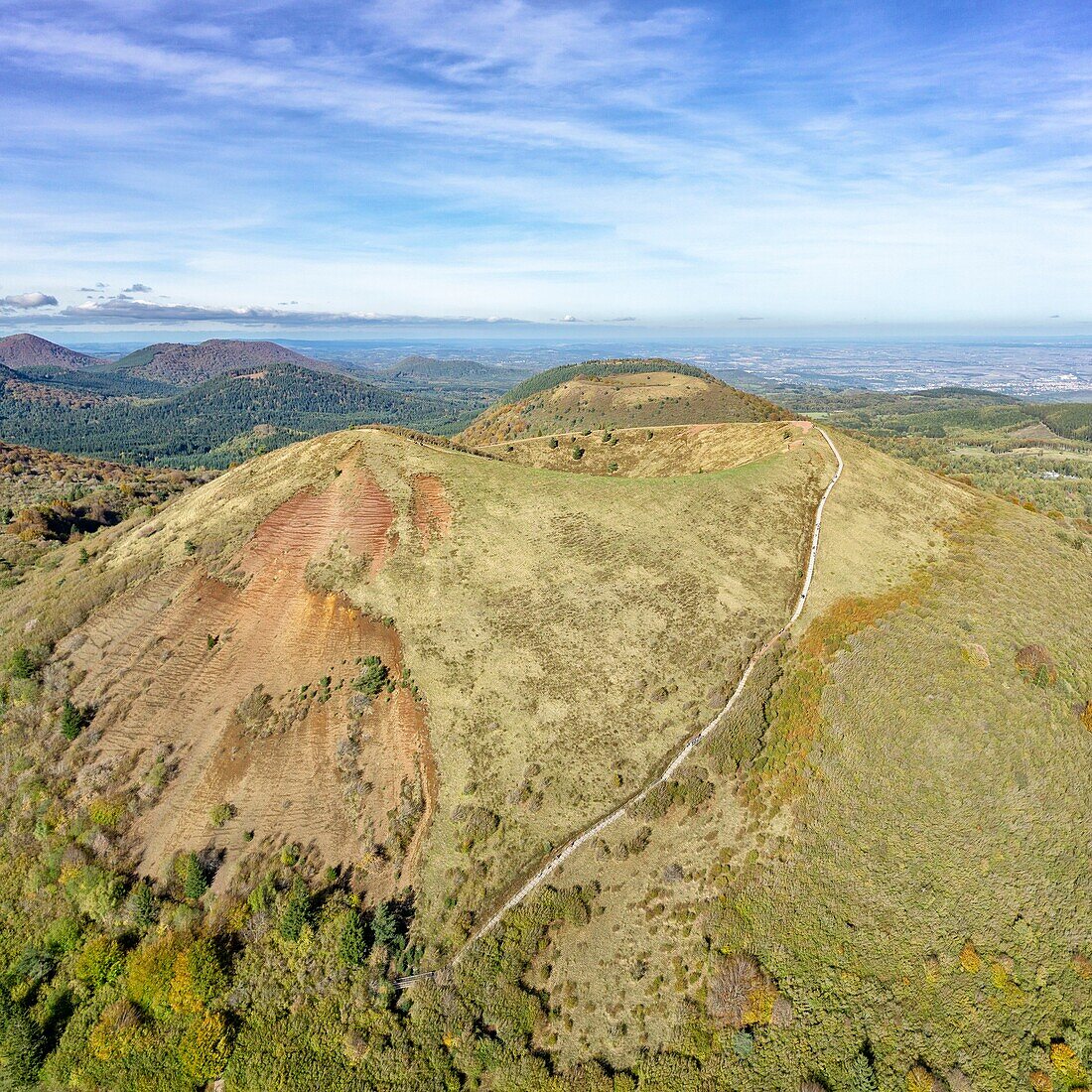France, Puy de Dome, Orcines, Regional Natural Park of the Auvergne Volcanoes, the Chaîne des Puys, listed as World Heritage by UNESCO, Puy Pariou volcano in the foreground (aerial view)\n