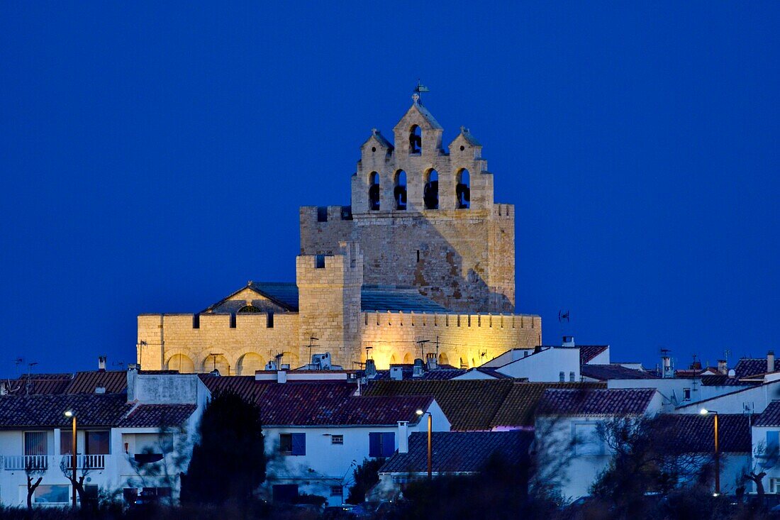 France, Bouches du Rhone, Camargue, Saintes Maries de la Mer, church illuminated by night\n