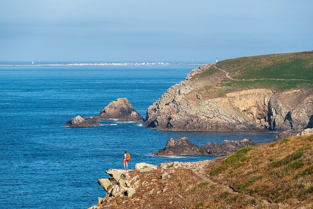 France, Finistere, Plogoff, along the GR 34 hiking trail or customs trail towards Pointe du Raz, Sein island in the background\n