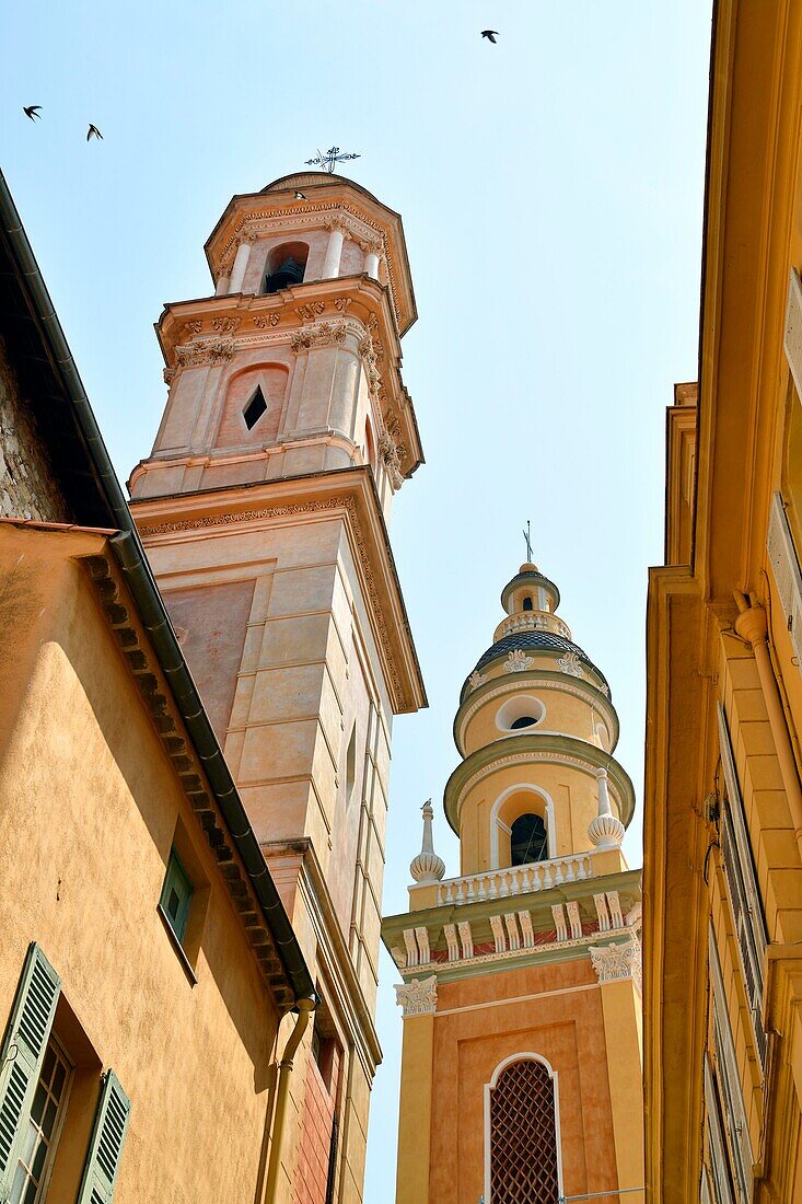 France, Alpes Maritimes, Cote d'Azur, Menton, the old town, bell towers of the Immaculate Conception chapel or White Penitent and the Saint Michel Archange basilica\n