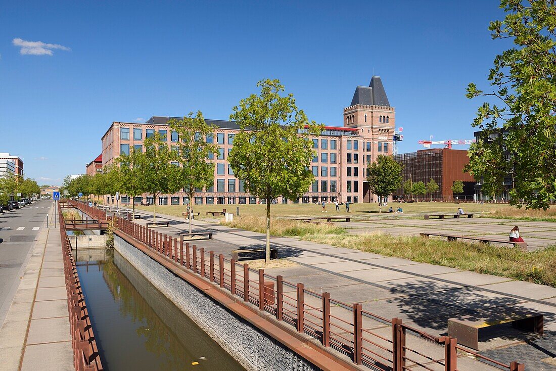 France, Nord, Lille, district of Bois Blancs, EuraTechnologies business park pole of excellence dedicated to the TIC of the Lille metropolis taking place in the Blan Lafont which is an old spinning mill built in 1900, small water channel at the edge of the site\n