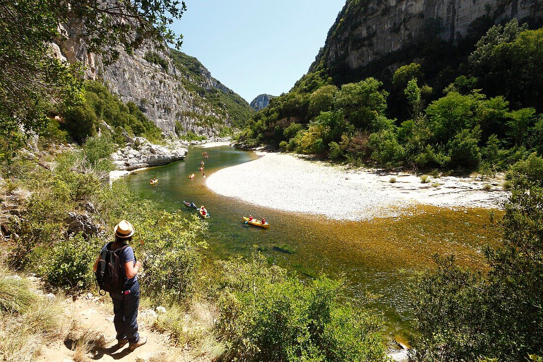France, Ardeche, Sauze, Ardeche Gorges natural national reserve, Female hiker on the downstream path of the Ardeche Canyon between Gournier bivouac and Sauze\n