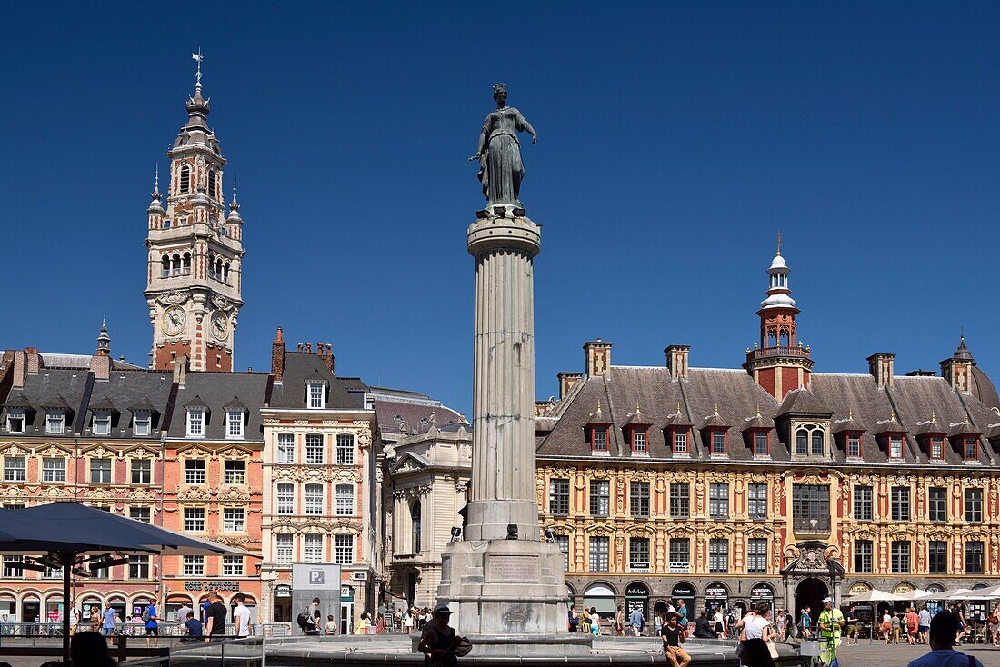 France, Nord, Lille, Place du General De Gaulle or Grand Place, statue of the goddess on its column with the old stock exchange and the belfry of the Chamber of Commerce and Industry\n