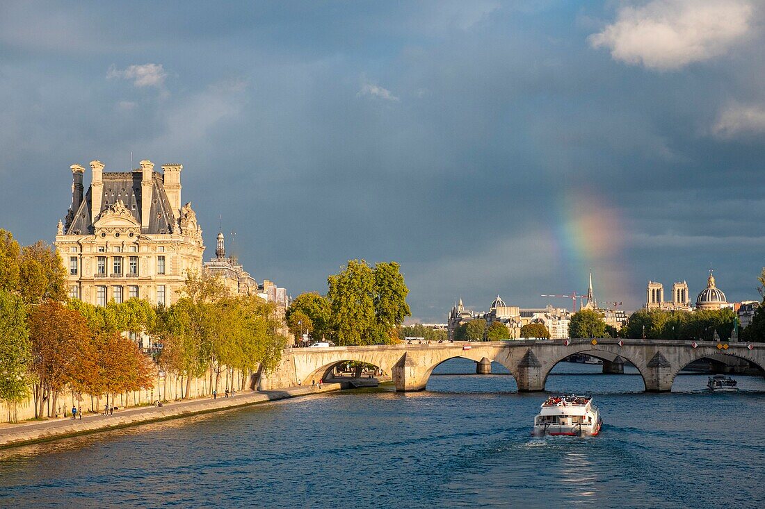 France, Paris, area listed as World Heritage by UNESCO, Carrousel Bridge, Rainbow and the Louvre Museum\n