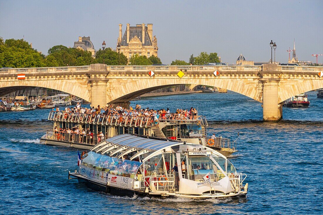 France, Paris, area listed as World Heritage by UNESCO, the Carousel bridge and a fly boat in front of the Louvre\n