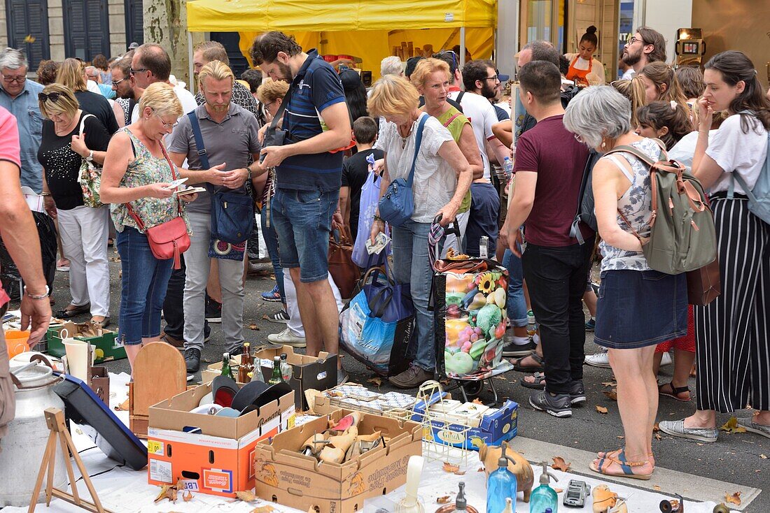 France, Nord, Lille, boulevard of Freedom, jumble sale 2019, walkers in front of a stand\n