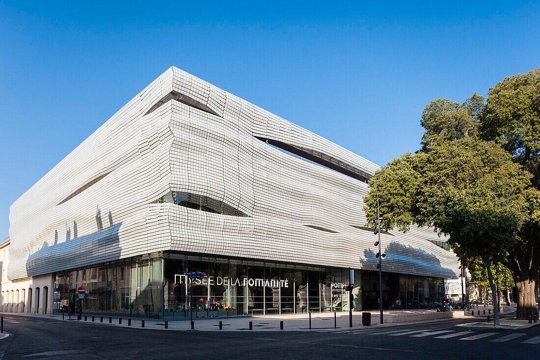 France, Gard, Nimes, Musee de la Romanite by architect Elizabeth de Portzamparc, front facade under the sun and brand sign\n