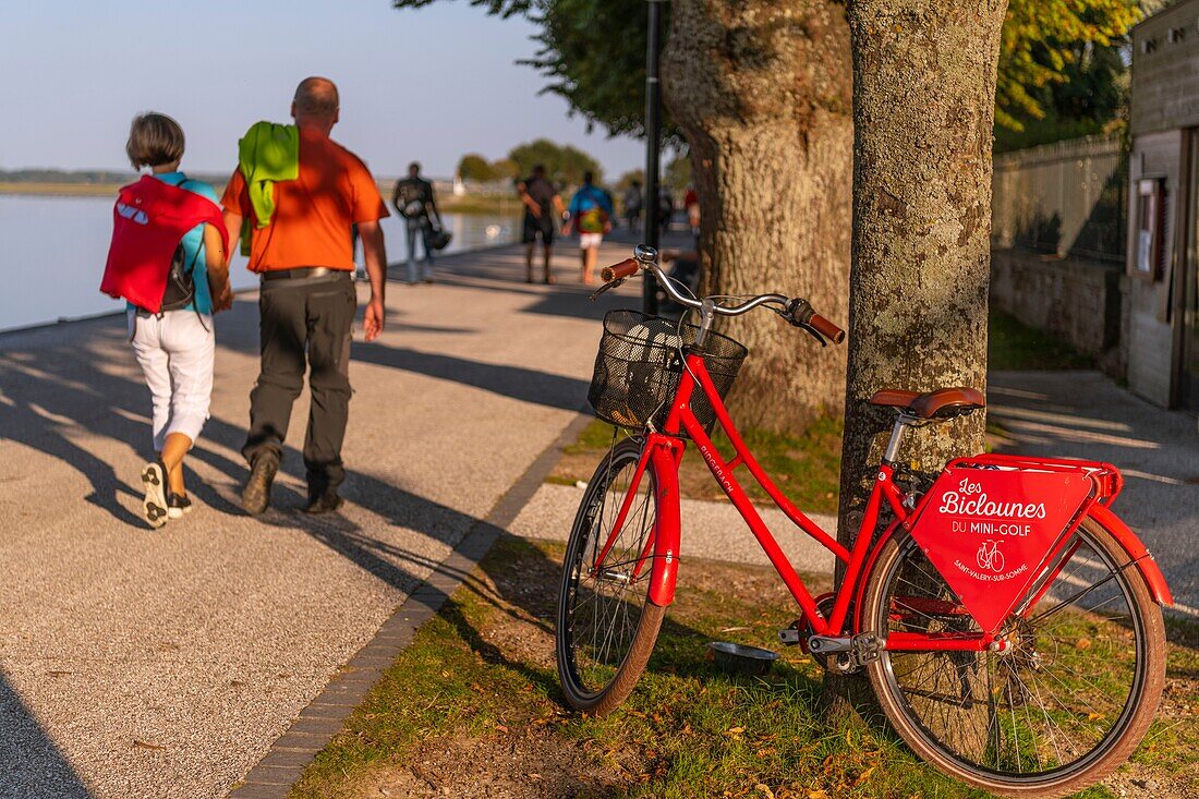 France, Somme, Somme Bay, Saint Valery sur Somme, red bike rental on the banks of the Somme, along the channel\n