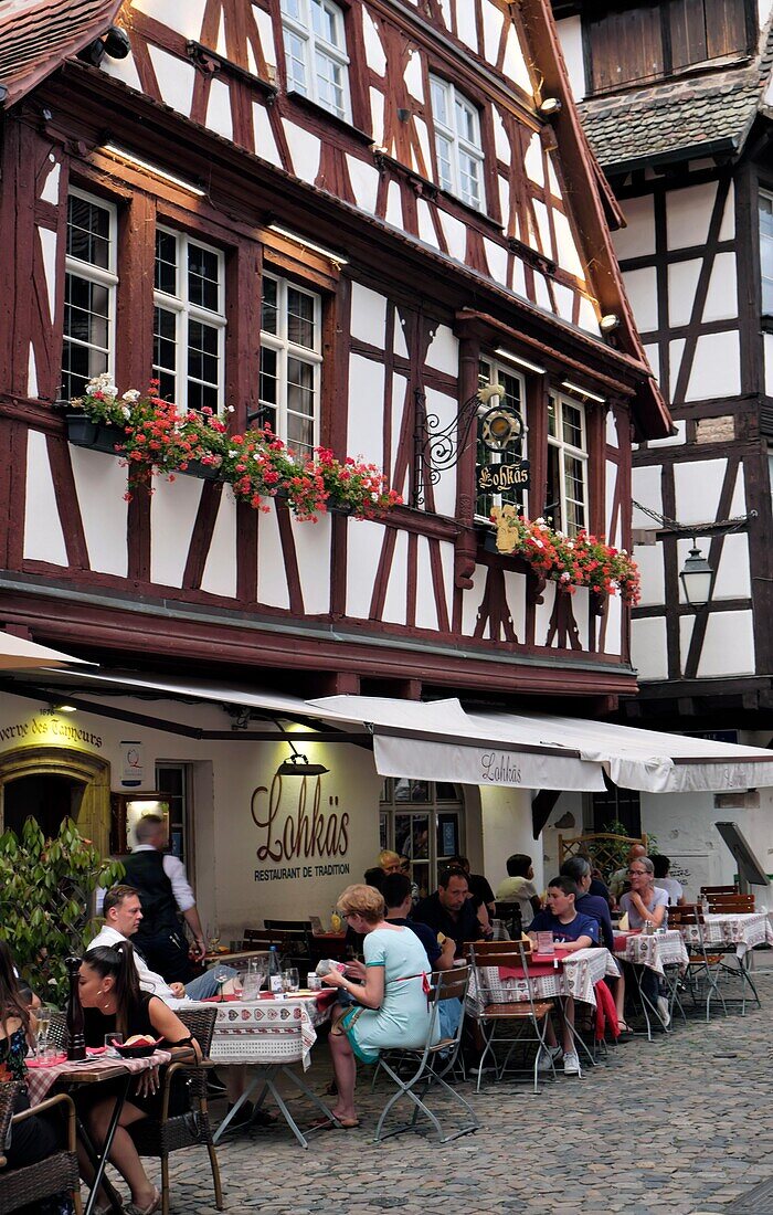 France, Bas Rhin, Strasbourg, old town listed as World Heritage by UNESCO, Rue du Bain aux Plantes, half timbered house dated 17th century, restaurant Lohkäs\n