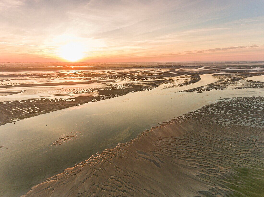 France, Somme, Baie de Somme, Le Hourdel, The tip of the Hourdel and the sand banks of the Baie de Somme at low tide (aerial view), the channel of the Somme extends to the sea\n