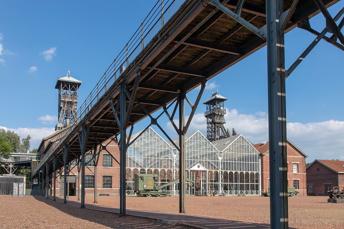 France, Nord, Lewarde, Mining History Centre listed as World Heritage by UNESCO, main courtyard in glass roof of machines and the footbridge of miners\n