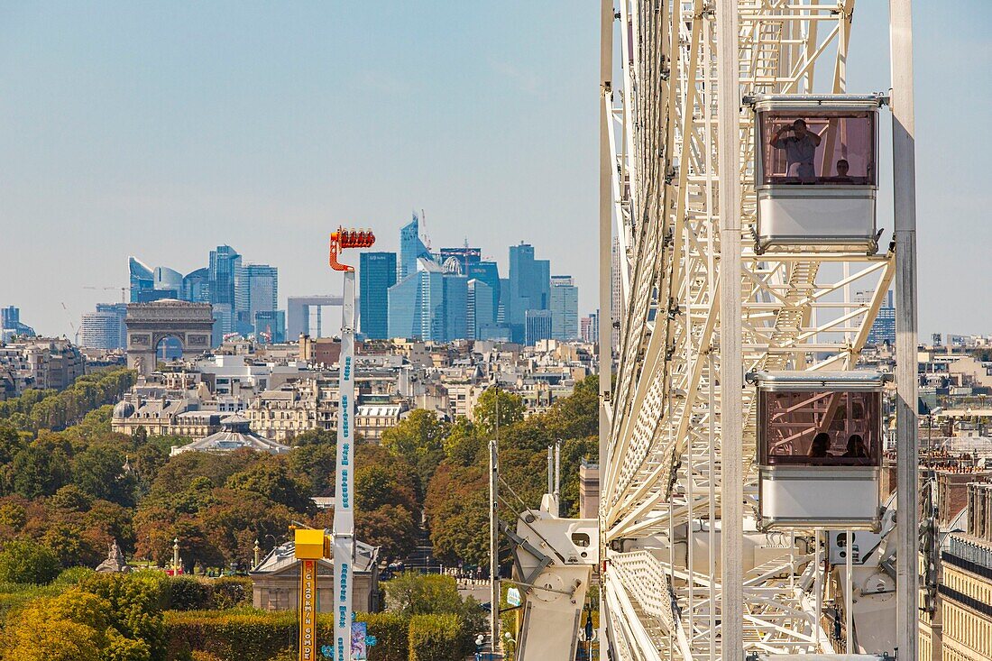 France, Paris, the funfair of the Tuileries, the Ferris wheel and the district of La Defense\n
